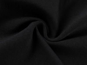 Macro shot of high-elasticity black knitted fabric showing soft texture and premium weave