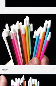Close-up of colorful disposable lip brushes with soft flocked tips for makeup application
