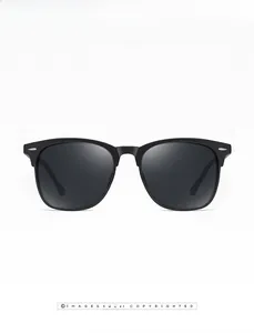Close-up of black polarized sunglasses with silver rivet accents and dark lenses