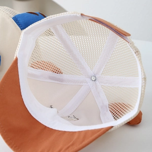Interior detail of a breathable mesh baby baseball cap with reinforced inner lining
