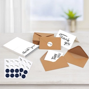 Minimalist white thank you cards set with brown envelopes and adhesive round stickers