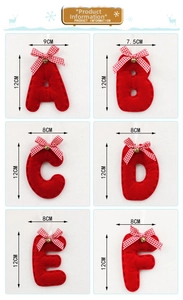 Detail of red felt Christmas alphabet pendants with plaid bows and golden bells