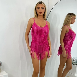 Detailed view of pink sequin halter dress with fringe tassels for beach vacation style