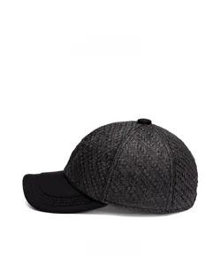 Side view of black woven texture baseball cap with breathable straw-like material detail