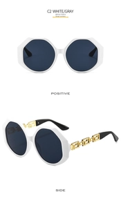 Detail of white polygon oversized sunglasses featuring golden Greek key patterned temples