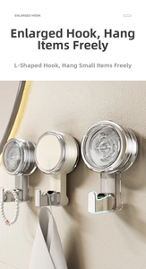 Detail of vacuum suction cup hooks in transparent silver and beige for wall storage