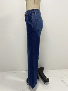 Detail of high waisted drawstring waistband on dark blue straight leg denim jeans