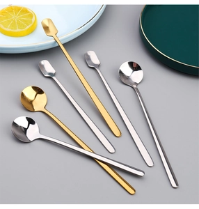 Set of 6 gold and silver stainless steel spoons with long and short handles on a grey background