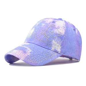 Detail of lavender tie-dye baseball cap with sparkling rhinestone bear design