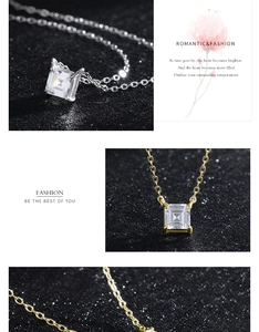Macro view of square-cut cubic zirconia pendant with four-prong setting in gold and silver