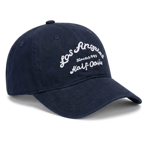 Detail of white Los Angeles embroidery on navy cotton twill baseball cap