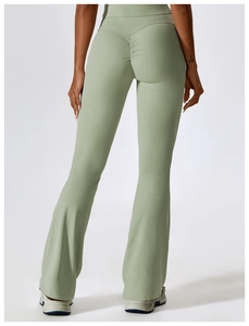 Detail of high waist yoga flare pants featuring scrunch butt lifting design in sage green