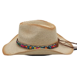 Detail of woven straw cowboy hat with bohemian bead band and gradient brim edge