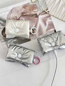 Quilted bow wireless headphone case in metallic silver and pearlescent white finish