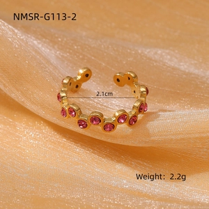 Detail showing pink zircon insets and 2.1cm inner diameter for adjustable gold ring