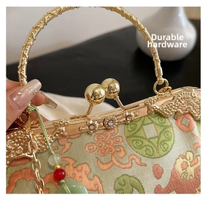 Detail of vintage gold metal frame and jacquard silk fabric with traditional pattern