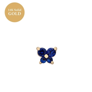 Detailed macro view of 14K solid gold butterfly stud earring with blue zircon stone