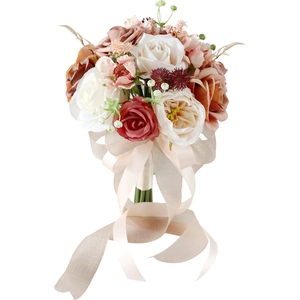 Bridal wedding bouquet with roses in red, white and pink with champagne silk ribbons