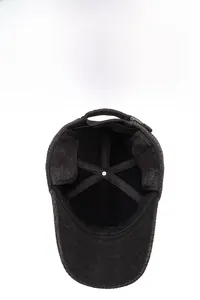 Detail view of winter baseball cap with plush fleece lining and fold-down ear flaps