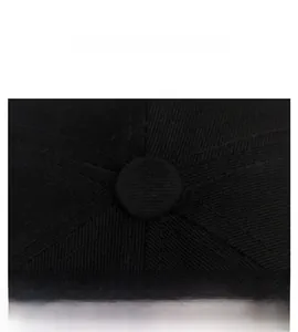 Top detail of black cotton baseball cap showing button and reinforced stitching