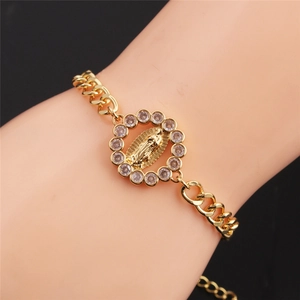 Gold Virgin Mary charm bracelet with cubic zirconia paving on adjustable Cuban link chain