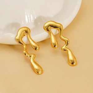 Close-up of 18k gold plated irregular teardrop earrings with fluid wavy design