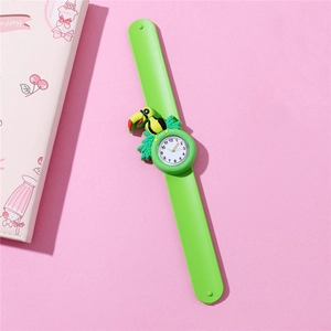 Detail of green silicone slap watch featuring a 3D cartoon toucan on a bright pink background