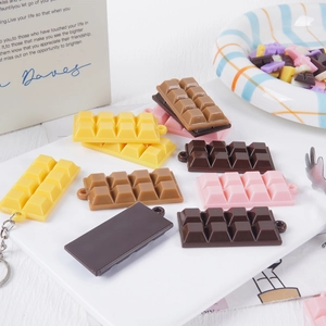 Realistic chocolate block keychain charms in multiple colors with metallic keyrings