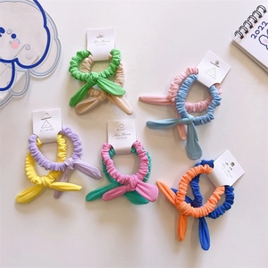Set of pastel rabbit ear hair scrunchies in colorful soft ribbed fabric for children