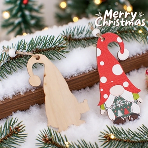 Christmas wooden gnome pendants with red polka dot hat and snowflake pattern on pine branch