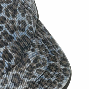 Close-up of leopard print baseball cap brim with durable multi-row stitching detail