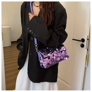 Close-up of purple sequin crossbody bag showing shimmering texture and classic flap design