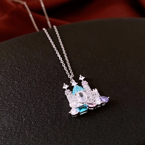 Macro shot of 18K silver-plated castle pendant necklace with zircon gemstones