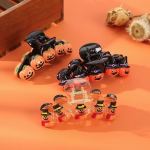 Whimsical Halloween pumpkin hair clips featuring wizard hats on an orange background