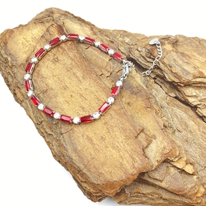 Titanium steel bracelet with red rectangular stones and white zircons on natural bark