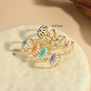 Gold open rings with colorful enamel evil eye designs in various sizes and vibrant finishes