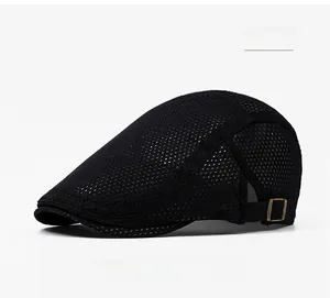 Detail view of the breathable black mesh fabric and metal adjustment buckle on the flat cap