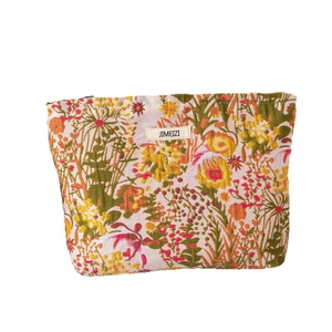 Large capacity floral makeup bag with relief flower patterns and zipper closure