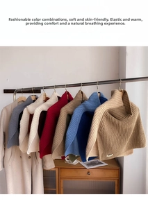 Detailed view of color-block knitted high-neck ponchos in various autumn winter colors