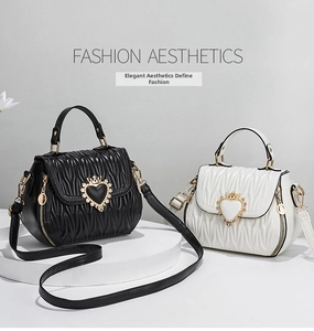 Detail of black and white matelasse bucket bags with crown heart buckles