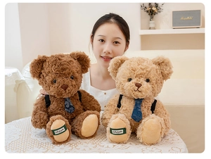 Detail of plush teddy bears with blue bow ties and backpacks in a home setting