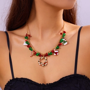Festive gold necklace featuring Christmas bells, trees, and crystal wreath pendant charm