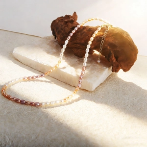 Close-up of colorful freshwater pearl necklace with 14K gold plated clasp and extender