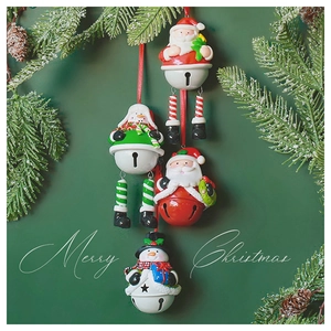 Detailed close-up of handmade Santa and Snowman resin bells for Christmas tree decoration