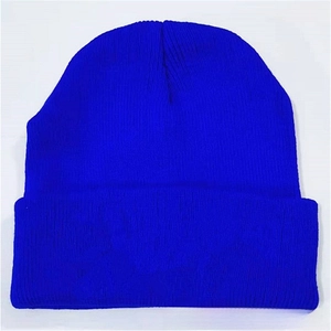 Close-up of the royal blue ribbed knit beanie featuring a wide folded cuff design