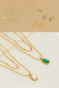 Close-up of double layer necklace with emerald green rectangular zircon pendant