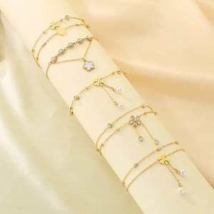 Golden double-layer clover anklet with heart shell petals and sparkling crystals
