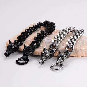 Close-up of punk wolf head bracelets in black and antique silver on natural stones