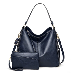 Navy blue faux leather tote bag and pouch set with gold hardware and pebble texture