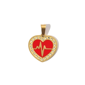 Close-up of golden heart pendant with red enamel, EKG wave and white rhinestone border